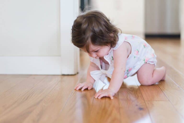 picture of baby crawling for article about best diapers for crawling babies